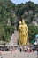 Golden statue of Lord Muragan at the entrance of Batu Caves Hindu Temple near Kuala Lumpur, Malaysia