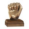 Golden statuette of a hand with fingers clenched into a fist on a wooden stand on a white background. 3d rendering