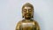 Golden statuette of a seated Buddha Shakyamuni