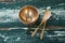 Golden steel bowl, spatula and spoon on table