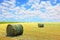 Golden stubble field and hay bales.