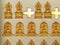 Golden stucco Buddha statue on the wall to decorate the place and worship