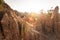 Golden sun shines down around the Sao Din Na Noi site displays picturesque scenery of eroded sandstone pillars. Ancient scenic