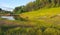 Golden sunlight on Parkview Pond and hillside