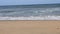 Golden sunlight reflecting on a beach in Lagos, Nigeria. Sun shining in the evening - waves breaking on the shore. golden sunlight