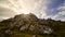 Golden sunrise on the mountain with sun rays coming out from behind the rocks and idyllic atmosphere. La Hiruela Madrid