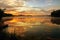 Golden sunrise on sky and in pond in summer morrning, Zizpasky pond