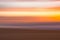 Golden sunset on the beach, an  abstract seascape with blurred panning motion