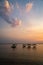 Golden sunset on the beach of the island of Ometepe with fisher huts.