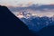 Golden sunset light hitting snow capped mountain peaks in Golden Ears Provincial Park