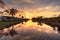 Golden sunset over a Gordon River tributary that winds through Golden Gate