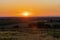 A golden sunset over the rolling hills in Banholt, south Limburg in the Netherlands creating holiday vibes