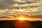 Golden sunset over sunflower fields, mystical clouds in the sky