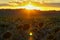 Golden sunset over sunflower fields, mystical clouds in the sky