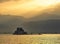 Golden sunset and waters over fortress of Bourtzi in Nafplio cit