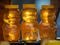 Golden sweet honey in plastic bottle in grocery market
