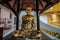 A golden tall Buddha standing at wat Intharawihan.