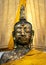 A golden tall Buddha standing at wat Intharawihan.