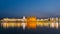 The Golden Temple at Amritsar, Punjab, India, the most sacred icon and worship place of Sikh religion. Illuminated in the night, r