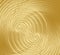 Golden texture with overlapping fine spiral shapes, decorative metallic texture