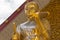 Golden thai monk statue in temple