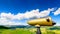 Golden tourist telescope and blurred mountains landscape in the