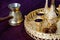 Golden Traditional Arabic coffee set with dallah, coffee pot jezva, cup and dates. Dark background.