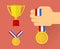 Golden trophy, golden medal with ribbon and hand holding medal