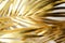 Golden tropical palm leaves, modern boho chic background