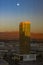 Golden Trump Tower at Dusk under a rising moon