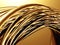 Golden tubes metallic wavy background