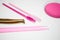 Golden tweezers, microbrush, finished bundles, pink brushes, eye patches