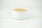 Golden under eyes patches in a white container, anti aging skin care, white wet background