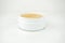 Golden under eyes patches in a white container, anti aging skin care, white wet background