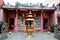 Golden urn and guard lions at entrance to Chinese temple Kuching Sarawak Malaysia