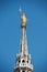 Golden Virgin Mary statue on top roof of Duomo