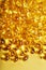 Golden Vitamin D3 Capsules close-up in full screen