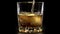 Golden Whiskey Pouring into Glass. Pouring of scotch whiskey or cognac into glasses with ice cubes on black background 5