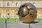 Golden world ball in Vatican with green grass. Rome, Italy.