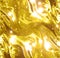 Golden wrapping paper or satin texture