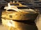 Golden yacht. Gold super yacht in Ibiza harbour