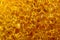 Golden yellow macro close up of scouring sponge pad