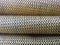 Golden yellow mat stack background.  coarse and stiff textured fabric folds