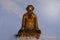 Golden Zen Buddhist Monk Figurine meditating in the Snow