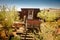 Goldfield Gold Mine`s old dangerous entrance to a gold mine shaft with trolley and rails leading inside