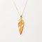 Goldplated Leaf Necklace With Feather Rendering And Maori Art