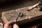 goldsmith jeweler soldering a silver ring on the workbench with a soldering.