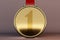 Goledn medal on brown background