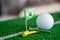 Golf ball with Brazil flag and tee on green lawn or grass is most popular sport in the world