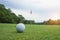 Golf ball on green in the evening golf course with sunshine in thailand